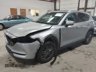 2020 Mazda CX-5 Touring with VIN JM3KFBCMXL0784653, listed as a IAAI auction lot 41817904 with 71,513 mi miles and . Bid and sale history available at carsss.com. Image 2.