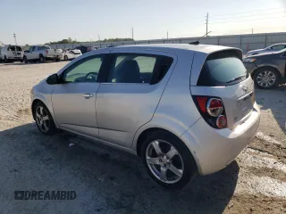 2012 Chevrolet Sonic LTZ z VIN 1G1JE6SH4C4101608, wystawiony jako Copart lot #53111725 z przebiegiem 203 012 mil mil oraz Szkoda całkowita • Salvage title. Historia ofert i sprzedaży dostępna na DreamBid. Obrazek 2.