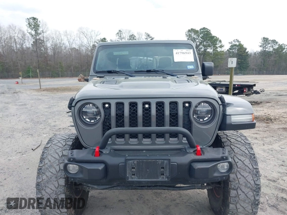 2021 Jeep Gladiator Rubicon with VIN 1C6JJTBG7ML554354, listed as a IAAI auction lot 41796943 with 61,513 mi miles and . Bid and sale history available at DreamBid. Image 13.