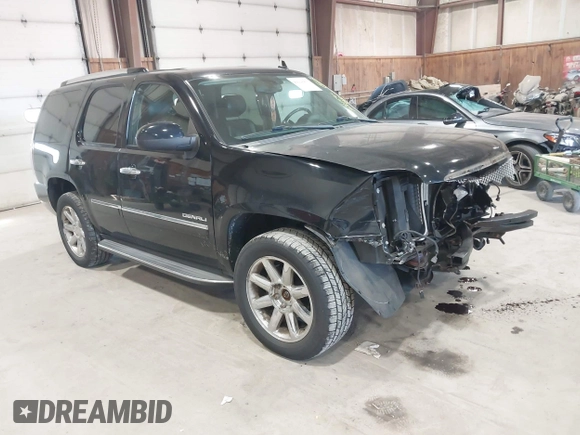 2013 GMC Yukon Denali with VIN 1GKS2EEF0DR105804, listed as a IAAI auction lot 42028402 with 121,054 mi miles. Bid and sale history available at carsss.com. Image 1.