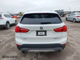 2019 BMW X1 xDrive28i with VIN WBXHT3C51K5L90392, listed as a IAAI auction lot 41571403 with 96,732 mi miles. Bid and sale history available at carsss.com. Image 16.