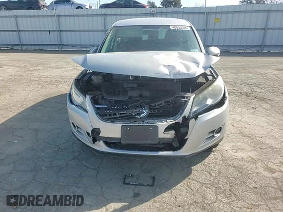 2010 Volkswagen Tiguan S with VIN WVGAV7AX9AW519312, listed as a Copart auction lot 48633055 with 94,740 mi miles and Salvage title. Bid and sale history available at DreamBid. Image 10.