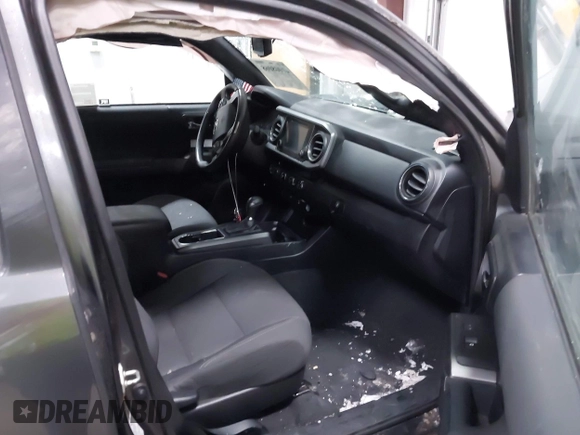 2016 Toyota Tacoma SR5 with VIN 3TMDZ5BNXGM009423, listed as a IAAI auction lot 41008068 with 107,426 mi miles and . Bid and sale history available at DreamBid. Image 5.