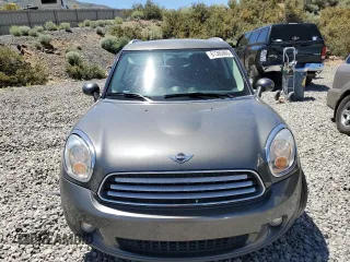 2014 MINI Countryman with VIN WMWZB3C56EWR38919, listed as a Copart auction lot 61385865 with 127,368 mi miles and Salvage title. Bid and sale history available at DreamBid. Image 5.