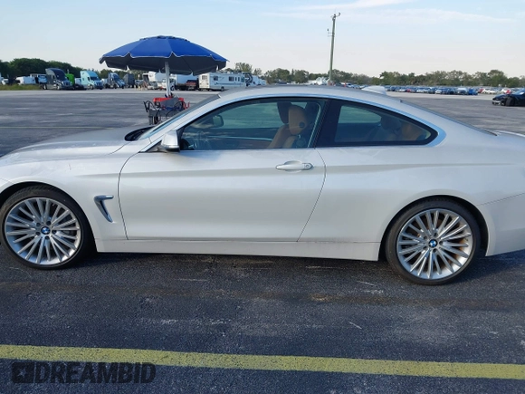 2014 BMW 4 Series 435i with VIN WBA3R1C51EK192795, listed as a IAAI auction lot 41263037 with 22,937 mi miles and . Bid and sale history available at DreamBid. Image 14.