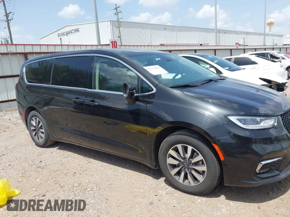 2023 Chrysler Pacifica Hybrid Touring L with VIN 2C4RC1L70PR622000, listed as a IAAI auction lot 42711826 with 65,109 mi miles and . Bid and sale history available at DreamBid. Image 14.
