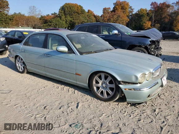 2005 Jaguar XJ with VIN SAJWA79C15SG48962, listed as a Copart auction lot 75674034 with 0 mi miles and Salvage Title. Bid and sale history available at carsss.com. Image 4.