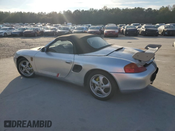 1998 Porsche Boxster с VIN WP0CA2987WS620369, выставлен на аукционе Copart как лот 81003964 с пробегом Не указан миль и Списание • Salvage title. История ставок и продаж доступна на DreamBid. Изображение 2.
