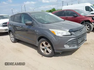 2013 Ford Escape SE with VIN 1FMCU0GX5DUA10943, listed as a IAAI auction lot 42050783 with 136,063 mi miles. Bid and sale history available at carsss.com. Image 1.