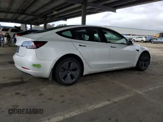 2023 Tesla Model 3 with VIN 5YJ3E1EA7PF488316, listed as a Copart auction lot 49655325 with 60,589 mi miles and Salvage Title. Bid and sale history available at DreamBid. Image 3.