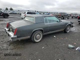 1984 Cadillac Eldorado z VIN 1G6AL5781EE619594, wystawiony jako Copart lot #80918934 z przebiegiem 47 529 mil mil oraz Szkody całkowita. Historia ofert i sprzedaży dostępna na DreamBid. Obrazek 3.