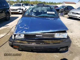 1989 Toyota Corolla z VIN 1NXAE92E2KZ028800, wystawiony jako Copart lot #74139934 z przebiegiem 78 479 mil mil oraz Nie do naprawy • Non repairable. Historia ofert i sprzedaży dostępna na DreamBid. Obrazek 5.