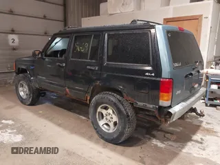 1998 Jeep Cherokee Sport z VIN 1J4FJ68S2WL142027, wystawiony jako IAAI lot #42305669 z przebiegiem 249 580 mil mil oraz . Historia ofert i sprzedaży dostępna na DreamBid. Obrazek 3.