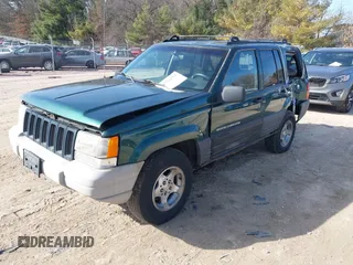 1997 Jeep Grand Cherokee Laredo with VIN 1J4GZ58S2VC595442, listed as a IAAI auction lot 41772133 with 229,764 mi miles. Bid and sale history available at carsss.com. Image 2.
