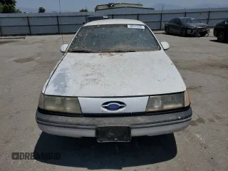1989 Ford Taurus GL z VIN 1FABP52UXKG244224, wystawiony jako Copart lot #59239225 z przebiegiem 30 853 mil mil oraz Czysty tytuł • Clean title. Historia ofert i sprzedaży dostępna na DreamBid. Obrazek 5.