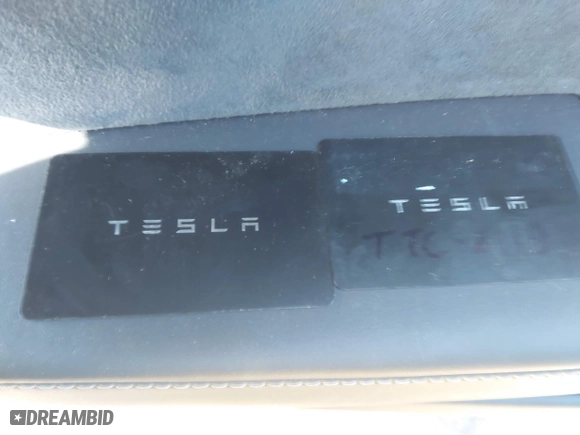 2023 Tesla Model 3 with VIN 5YJ3E1EA3PF678825, listed as a IAAI auction lot 41283153 with 8,607 mi miles. Bid and sale history available at carsss.com. Image 11.