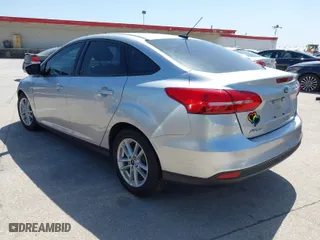 2017 Ford Focus SE with VIN 1FADP3F21HL263170, listed as a IAAI auction lot 41990977 with 104,794 mi miles. Bid and sale history available at carsss.com. Image 3.