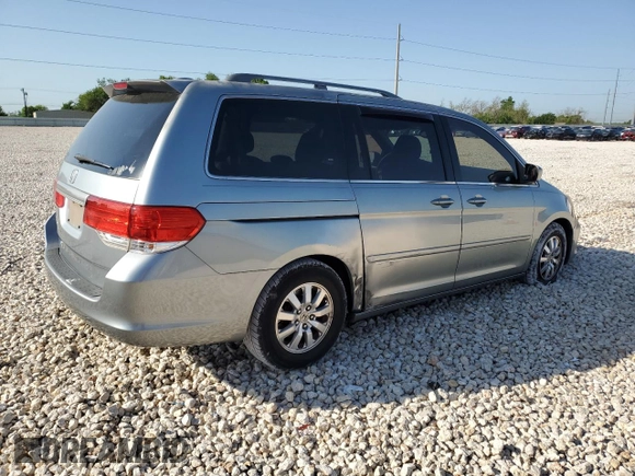 2009 Honda Odyssey EX-L with VIN 5FNRL38799B034292, listed as a Copart auction lot 52547205 with 116,658 mi miles and Salvage Title. Bid and sale history available at DreamBid. Image 3.