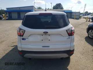 2017 Ford Escape SE z VIN 1FMCU0GD8HUA54074, wystawiony jako Copart lot #58860525 z przebiegiem 149 668 mil mil oraz Szkoda całkowita • Salvage title. Historia ofert i sprzedaży dostępna na DreamBid. Obrazek 6.