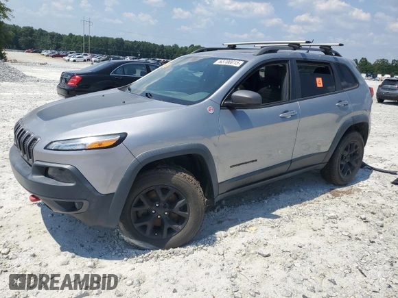 2015 Jeep Cherokee Trailhawk with VIN 1C4PJMBS3FW735398, listed as a Copart auction lot 63700015 with 157,123 mi miles and Clean title. Bid and sale history available at DreamBid. Image 1.
