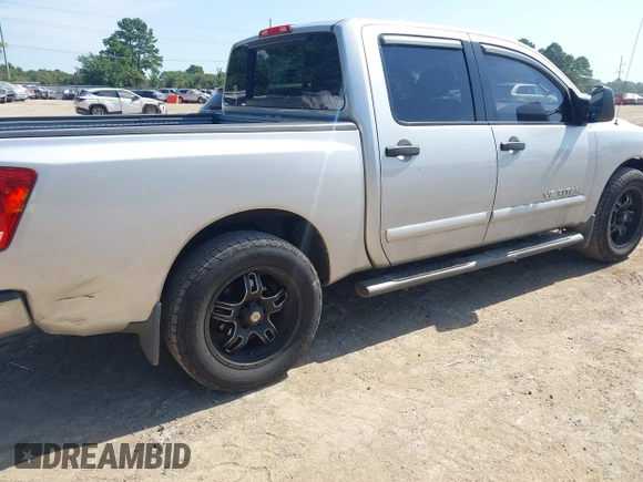 2012 Nissan Titan SV with VIN 1N6BA0ED8CN320723, listed as a IAAI auction lot 42642482 with 214,941 mi miles and . Bid and sale history available at DreamBid. Image 4.