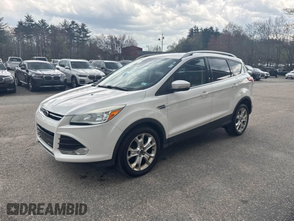 2014 Ford Escape Titanium with VIN 1FMCU9J94EUC63638, listed as a IAAI auction lot 42196241 with 198,112 mi miles and . Bid and sale history available at DreamBid. Image 2.