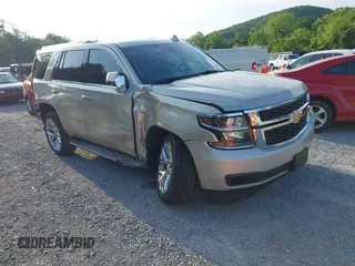 2016 Chevrolet Tahoe LT with VIN 1GNSKBKC9GR480560, listed as a IAAI auction lot 42436271 with 106,820 mi miles and . Bid and sale history available at DreamBid. Image 1.