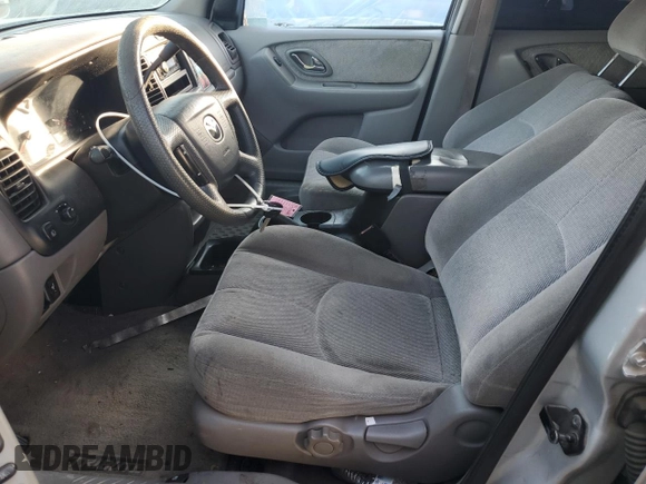 2002 Mazda Tribute LX with VIN 4F2YU09182KM64860, listed as a Copart auction lot 77391824 with 207,965 mi miles and Salvage Title. Bid and sale history available at DreamBid. Image 7.