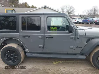 2021 Jeep Wrangler Unlimited Sport Altitude with VIN 1C4HJXDG1MW603784, listed as a IAAI auction lot 41509231 with 102,567 mi miles and . Bid and sale history available at DreamBid. Image 14.