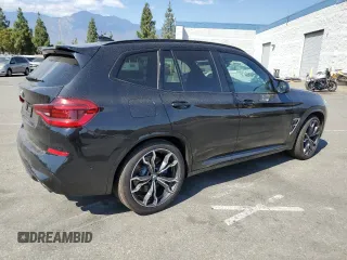 2021 BMW X3 M with VIN 5YMTS0C05M9F31855, listed as a Copart auction lot 71724374 with 30,814 mi miles and Salvage Title. Bid and sale history available at carsss.com. Image 3.