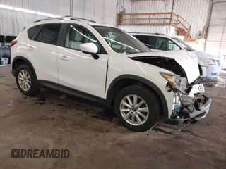 2014 Mazda CX-5 Touring with VIN JM3KE4CY4E0321055, listed as a IAAI auction lot 41613593 with 174,339 mi miles. Bid and sale history available at carsss.com. Image 1.
