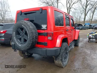 2015 Jeep Wrangler Unlimited Sahara with VIN 1C4BJWEG3FL590491, listed as a IAAI auction lot 41642219 with 148,759 mi miles. Bid and sale history available at carsss.com. Image 4.