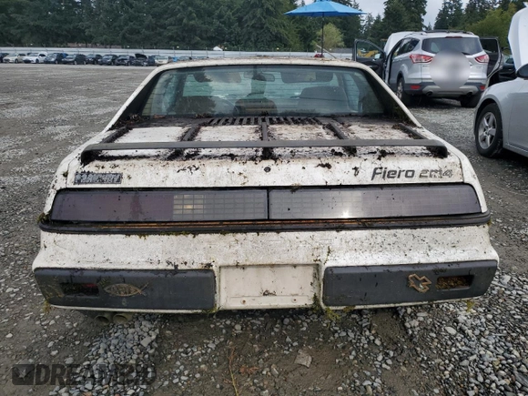 1984 Pontiac Fiero z VIN 1G2AF37R6EP320306, wystawiony jako Copart lot #68255394 z przebiegiem 49 284 mil mil oraz Czysty tytuł • Clean title. Historia ofert i sprzedaży dostępna na DreamBid. Obrazek 6.