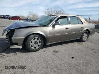 2002 Cadillac DeVille DHS z VIN 1G6KE57Y22U291523, wystawiony jako Copart lot #45711095 z przebiegiem 160 364 mil mil oraz Szkody całkowita. Historia ofert i sprzedaży dostępna na DreamBid. Obrazek 1.