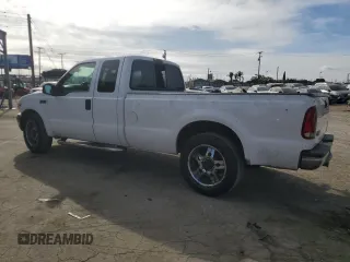 2001 Ford Super Duty F-250 XL with VIN 1FTNX20LX1EA37939, listed as a Copart auction lot 82408314 with 303,527 mi miles and Salvage Title. Bid and sale history available at carsss.com. Image 2.
