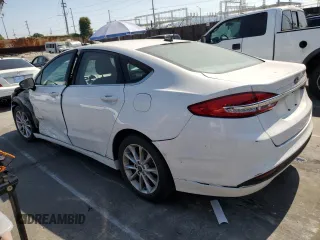 2017 Ford Fusion Hybrid SE z VIN 3FA6P0LU2HR209228, wystawiony jako Copart lot #62518055 z przebiegiem 119 174 mil mil oraz Szkoda całkowita • Salvage title. Historia ofert i sprzedaży dostępna na DreamBid. Obrazek 2.