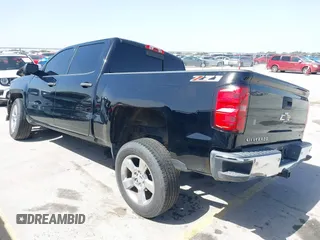 2014 Chevrolet Silverado 1500 LT with VIN 3GCUKREH8EG210945, listed as a IAAI auction lot 41718435 with 106,320 mi miles and . Bid and sale history available at DreamBid. Image 3.