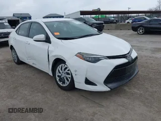 2019 Toyota Corolla L z VIN 5YFBURHE7KP884299, wystawiony jako IAAI lot #41459490 z przebiegiem 131 827 mil mil oraz . Historia ofert i sprzedaży dostępna na DreamBid. Obrazek 1.