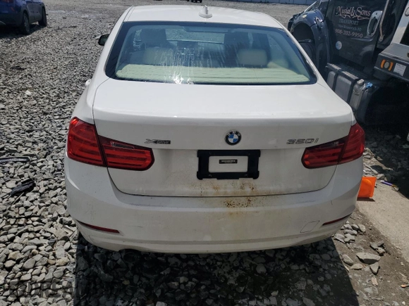 2014 BMW 3 Series 320i xDrive with VIN WBA3C3C51EF983592, listed as a Copart auction lot 60608765 with 195,061 mi miles and Salvage title. Bid and sale history available at DreamBid. Image 6.