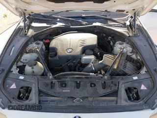 2013 BMW 5 Series 528i with VIN WBAXG5C56DD230121, listed as a IAAI auction lot 42019899 with 142,100 mi miles and . Bid and sale history available at carsss.com. Image 10.