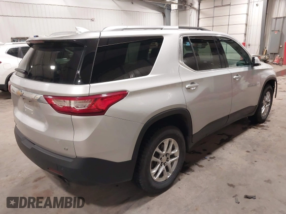 2018 Chevrolet Traverse LT Cloth z VIN 1GNEVGKW9JJ144070, wystawiony jako IAAI lot #42118002 z przebiegiem 142 006 mil mil oraz . Historia ofert i sprzedaży dostępna na DreamBid. Obrazek 4.