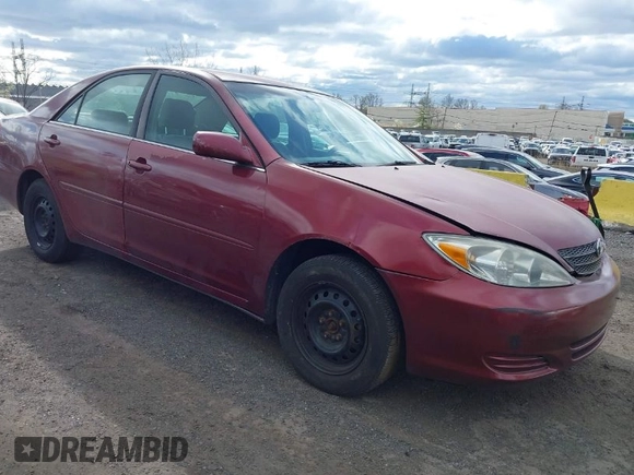 2004 Toyota Camry LE with VIN 4T1BE32K84U307551, listed as a IAAI auction lot 42054571 with 115,513 mi miles. Bid and sale history available at carsss.com. Image 1.