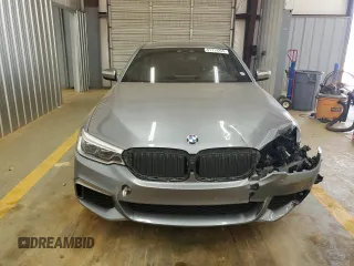 2018 BMW 5 Series M550i xDrive with VIN WBAJB9C55JB050213, listed as a Copart auction lot 61714255 with 34,700 mi miles and Salvage title. Bid and sale history available at DreamBid. Image 5.