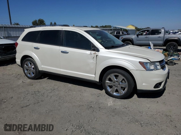 2013 Dodge Journey Crew with VIN 3C4PDCDG5DT668803, listed as a Copart auction lot 61931035 with 121,173 mi miles and Salvage title. Bid and sale history available at DreamBid. Image 4.