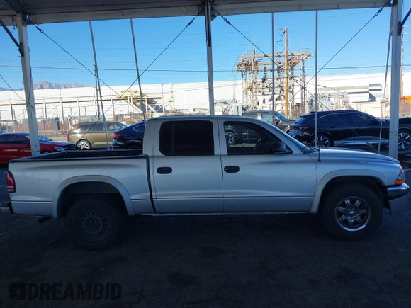 2003 Dodge Dakota SLT with VIN 1D7HL48N13S294573, listed as a IAAI auction lot 41291127 with 227,355 mi miles. Bid and sale history available at carsss.com. Image 13.
