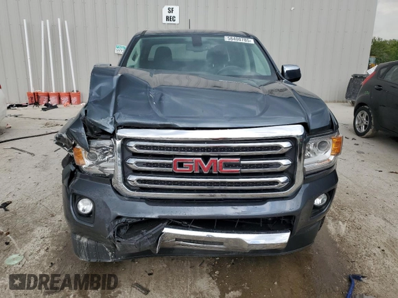 2015 GMC Canyon 4WD SLT z VIN 1GTG6CE38F1136669, wystawiony jako Copart lot #58400785 z przebiegiem 114 685 mil mil oraz Nie do naprawy • Non repairable. Historia ofert i sprzedaży dostępna na DreamBid. Obrazek 5.