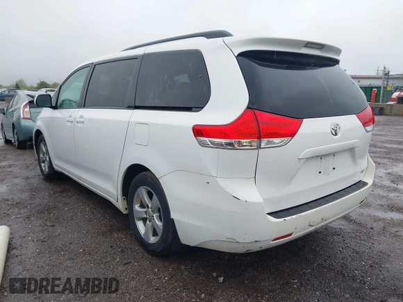 2012 Toyota Sienna LE AAS with VIN 5TDKK3DC3CS208853, listed as a IAAI auction lot 42205012 with 197,286 mi miles. Bid and sale history available at carsss.com. Image 3.