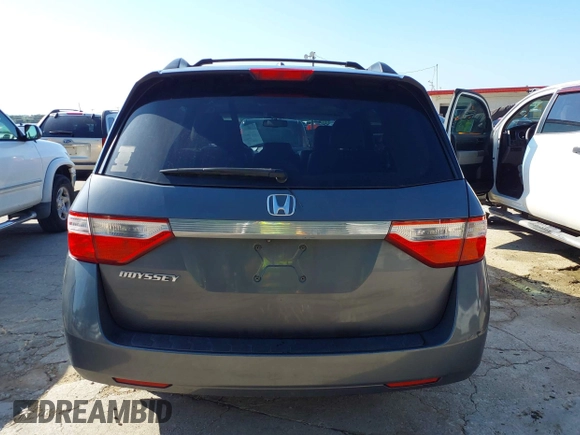 2011 Honda Odyssey EX-L with VIN 5FNRL5H6XBB073482, listed as a IAAI auction lot 42090463 with 213,061 mi miles and . Bid and sale history available at carsss.com. Image 16.