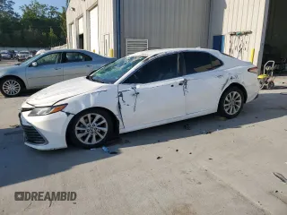 2023 Toyota Camry LE z VIN 4T1C11AK8PU077035, wystawiony jako Copart lot #53448575 z przebiegiem Nie podano mil oraz Szkoda całkowita • Salvage title. Historia ofert i sprzedaży dostępna na DreamBid. Obrazek 1.