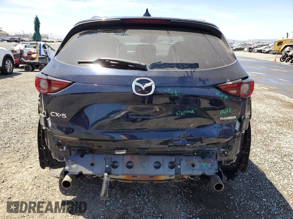 2020 Mazda CX-5 Grand Touring z VIN JM3KFADM4L0794765, wystawiony jako Copart lot #63850005 z przebiegiem 53 270 mil mil oraz Szkoda całkowita • Salvage title. Historia ofert i sprzedaży dostępna na DreamBid. Obrazek 6.